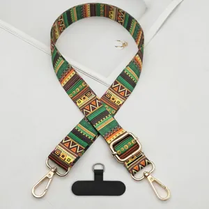 Bohemian ethnic style adjustable phone strap detail, featuring gold metal clasps and tab.