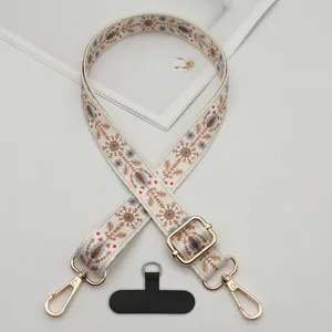 Ethnic style boho phone strap with adjustable metal buckle and secure tether tab for crossbody use.