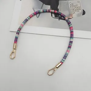 Detailed view of a 40cm colorful wrapped handbag strap replacement with gold metal clasps.