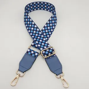 Adjustable replacement bag strap with blue geometric print and durable gold hardware.