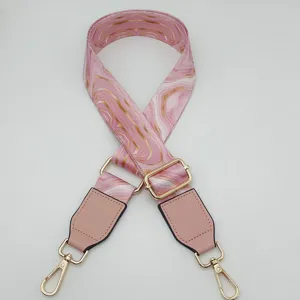 Pink marble pattern replacement bag strap with adjustable gold hardware for crossbody bags detail