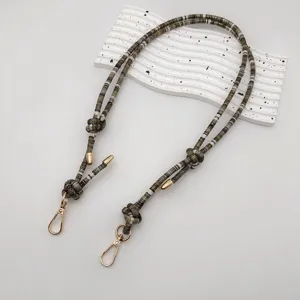 Detailed view of colorful beaded bag strap replacement, boho style lanyard with gold hardware.