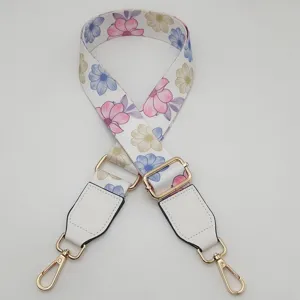 Floral print replacement bag strap with adjustable buckle and gold metal hardware for purses.