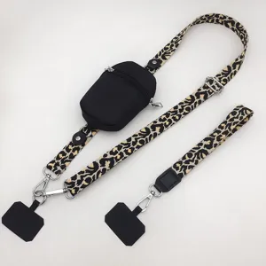 Leopard print phone lanyard detail showing the adjustable strap, zipper pouch and connectors.