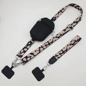 Detailed view of the universal phone lanyard with zipper pouch and adjustable leopard strap.