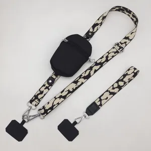Leopard print phone lanyard with zipper pouch, adjustable wide strap and universal tabs.