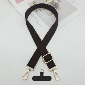Correa de telefono movil marron ajustable con herrajes dorados y lengueta para movil.