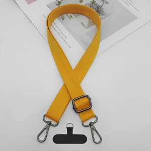 Correa de hombro ajustable para teléfono móvil amarillo y correa de repuesto.
