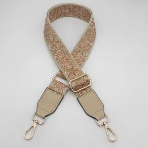 Detailed view of wide retro ethnic embroidered bag strap, adjustable crossbody replacement strap.