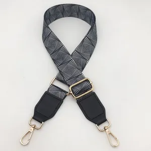 Black and white geometric pattern replacement bag strap adjustable crossbody strap accessory.
