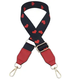 Stylish replacement bag strap with red heart print, adjustable crossbody strap with gold hardware.