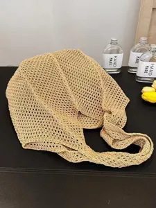 Detailed view of casual beige woven mesh shoulder bag, perfect for summer beach travel.