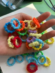 Detailed shot showing colorful elastic hair ties for kids, vibrant candy colors assortment.