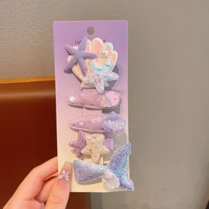 Children cute glitter starfish shell mermaid hair clip set detail closeup view purple card