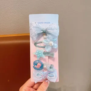 Kinder Haarklammer Detail Set mit blauer Schleife, Perlenblume, Seestern und Meerjungfrau.