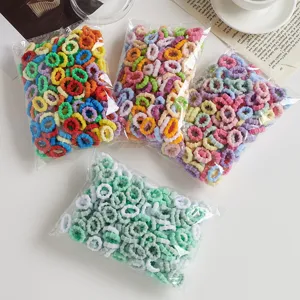 Bunte Mini Haargummis für Kinder, hochelastische weiche Frottee Haargummis in Beuteln.
