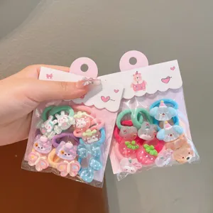 Cute cartoon hair ties detail view with colorful resin charms for kids and toddlers.