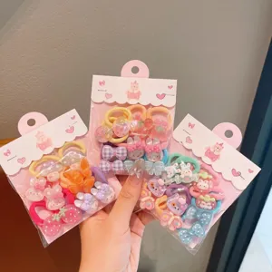 Cute kids hair ties set with colorful bows and resin charms for sweet girls styling.