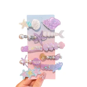 Cute mermaid hair clips set with pearls and shells for kids, sweet pastel hair accessories.