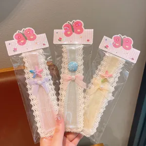 Detail shot of cute children lace hair fringe magic tape patches with lovely bow and starfish design.