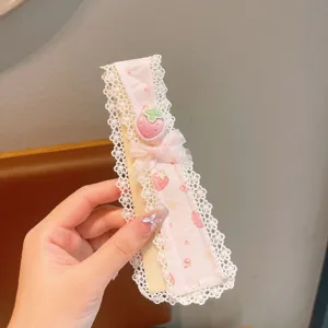 Close-up view of sweet pastoral lace floral bangs patch showing strawberry and bow detail.
