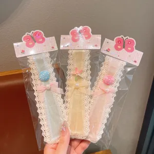 Detailed view of cute children lace hair clips featuring lovely shell and starfish decor.
