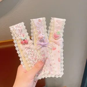 Cute floral lace hair bands with sweet strawberry and rabbit charms, perfect detail view.