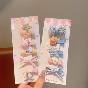 Cute children hair clips set with cartoon bows, strawberries and stars for girls daily wear.