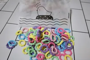 Colorful elastic hair ties for kids, soft candy color small hair bands bulk pack detail view.