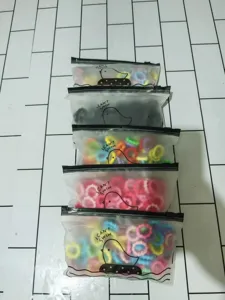 Detailed view of colorful hair ties neatly packed in frosted zipper bags for kids daily use.