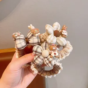 Cute plaid lace hair scrunchie with sweet cartoon bear and bunny charms for daily hair styling.