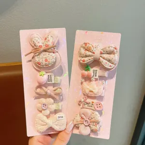 Cute floral kids hair clips set, handmade fabric bow and bunny pins for sweet girls daily wear.