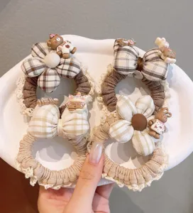 Sweet plaid hair scrunchies with cute lace trim, bow knots, and adorable bear resin pendants for women.