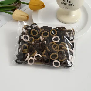 Mini elastic hair ties for kids, soft seamless baby hair bands in assorted earth colors.
