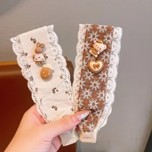 Detail shot of cute lace hair bangs paste with sweet resin charms for women and kids daily wear.