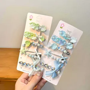 Dopamine aesthetic hair clip set featuring cute starfish shell pearls and shiny rhinestones.