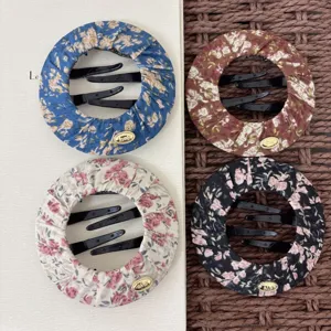 Detailed view of handmade floral fabric circular hair bun makers, secure and comfortable hair accessories.