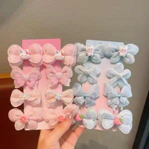 Joli ensemble de pinces à cheveux pour enfants avec nœuds doux pour coiffure quotidienne.