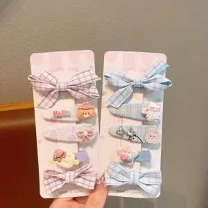 Korean children bow hair clip set sweet pink and blue plaid duckbill clips detail view