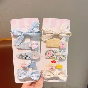 Cute kids hair clip set with sweet bow designs and cartoon accents for girls and toddlers.