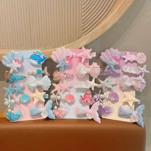 Cute cartoon ocean series children hair clips set with sweet starfish and mermaid tail designs.