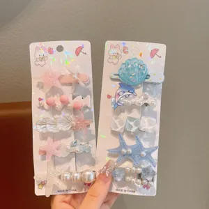 Kids summer ocean theme hair clip set featuring cute starfish shell and pearl designs for girls.