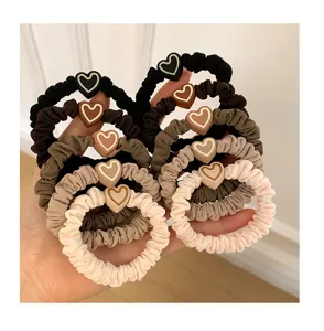 Detailed view of cute heart scrunchies, elastic hair ties, soft and durable for daily ponytail styling.