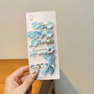 Blue ocean hair clip set with shells, pearls, and bows for stylish girls and daily wear.