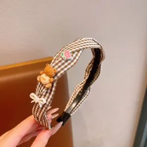 Cute brown plaid children headband with bear and bow detail, non-slip hair hoop for girls.