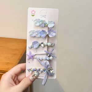Dopamine purple hair clip set featuring cute shell starfish bow and pearl rhinestone designs.