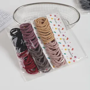 Detailed view of colorful seamless high-elastic hair ties set with display cards for styling.