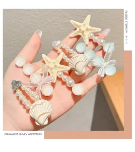 Colorful starfish and shell hair clips with pearls for girls, cute side hairpins and lovely headwear.