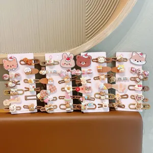Detailed shot of cute cartoon hair clips, featuring various animal and sweet designs for kids.