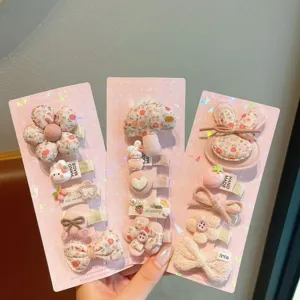 Cute cartoon fabric hair clip set for girls, sweet pink design, perfect daily hair accessories.